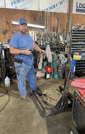 Man standing in a workshop working